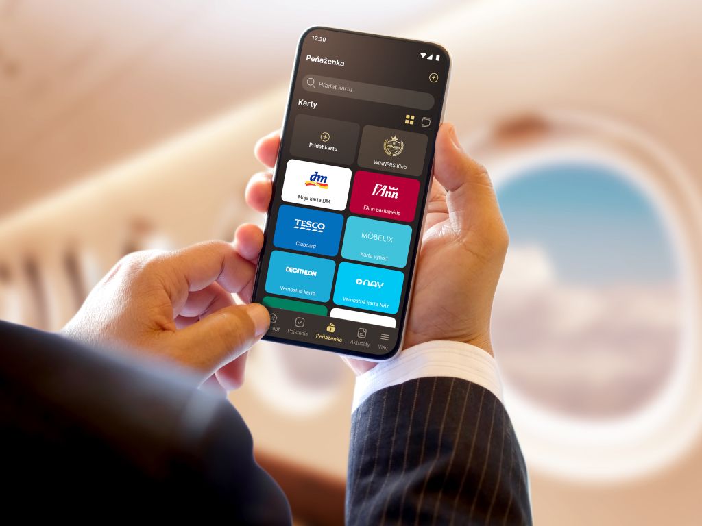Person holding a phone showing iWinners digital wallet with loyalty cards